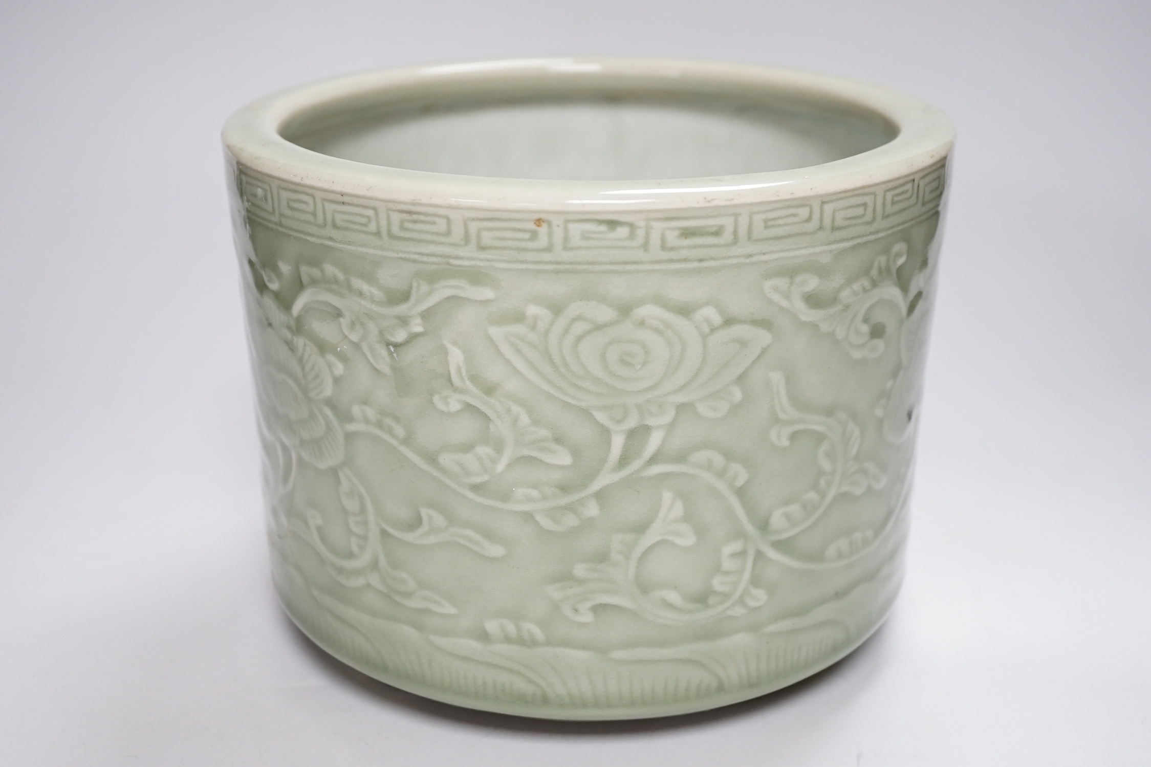 A Chinese celadon glazed tripod brushpot, 19th century